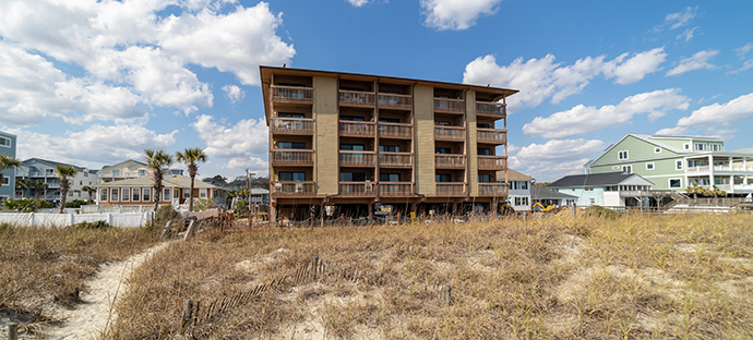 View of Ocean Inn condominium complex from the beach