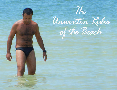 men in speedos on the beach
